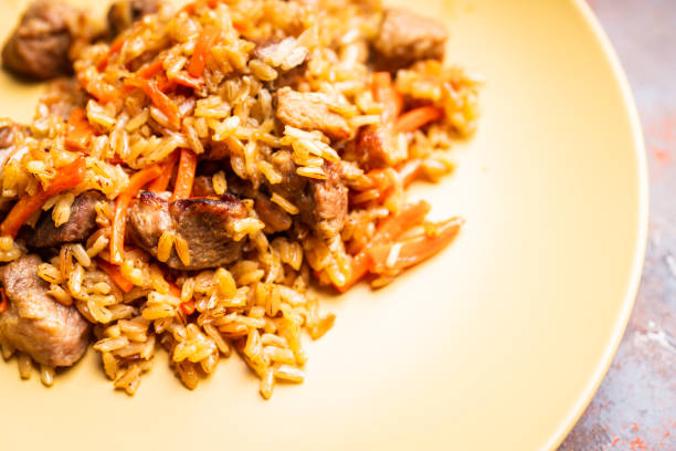 istock Traditional Uzbekistan pilaf on the rustic background 1217093684