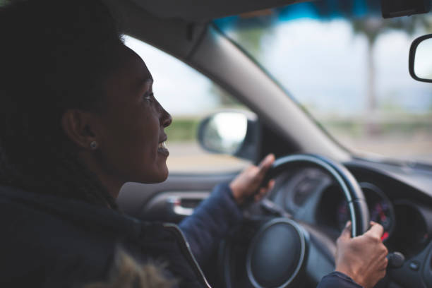 istock Woman driver driving a car. 1217093783
