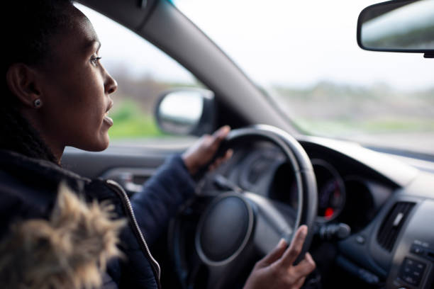 Woman driver driving a car.