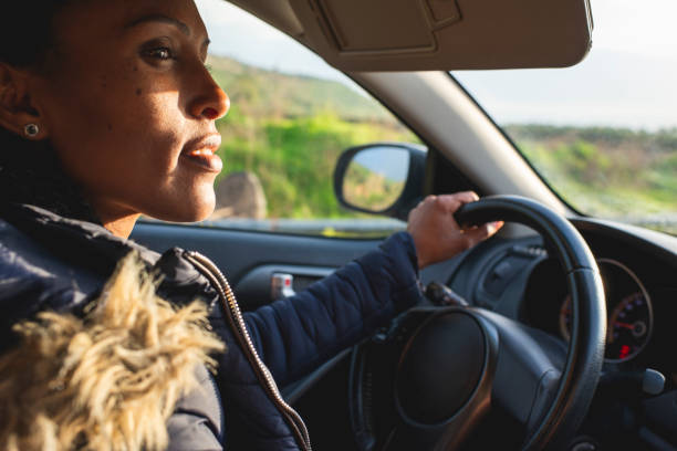 istock Woman driver driving a car. 1217094817