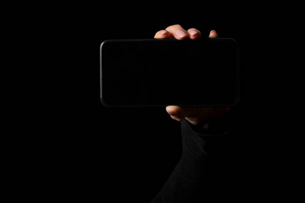 istock Person holding in hand smartphone with empty blank screen 1217094944