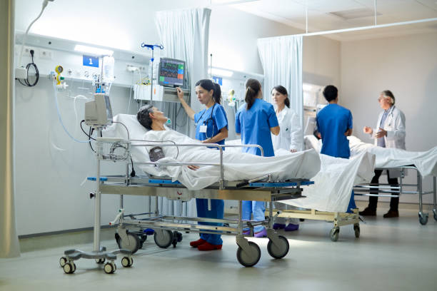 istock Three teams of doctors and nurses working at the post intensive care unit. 1217096087