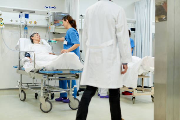 istock A nurse is talking with a patient after a surgical procedure. 1217096093