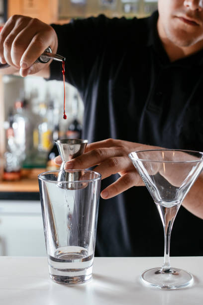 istock Barman making cocktails at bar 1217097213