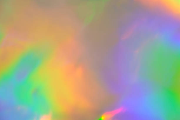 istock abstract holographic iridescent foil texture background with rainbow colored spots 1217097394