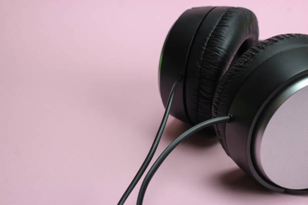 istock Full-Size Headphones on pink background 1217098126
