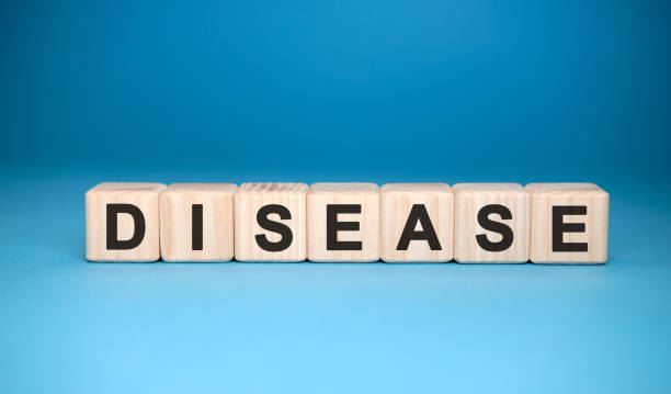 istock DISEASE word cube on a blue background. Medical concept. 1217100194