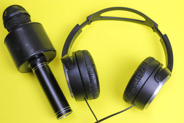 istock Vocal Bluetooth microphone and headphones on a yellow background 1217100209