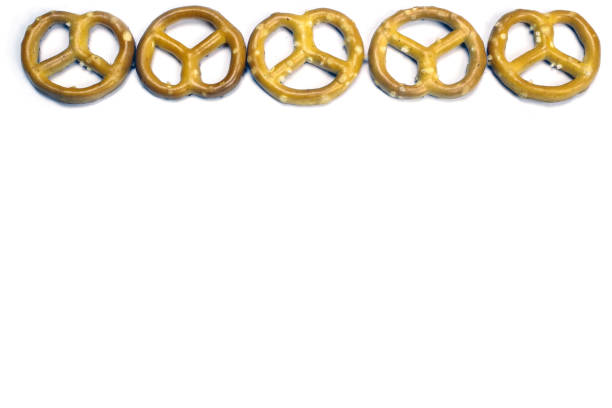 istock Crispy pretzels on white background. German beer snack. Close-up, isolate on white. Copy Space for text 1217100217