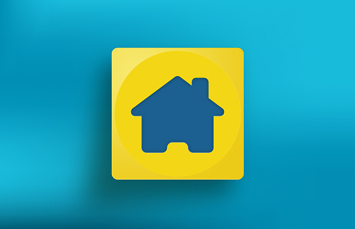 Yellow cube with Home icon on blue background. Horizontal composition with copy space.