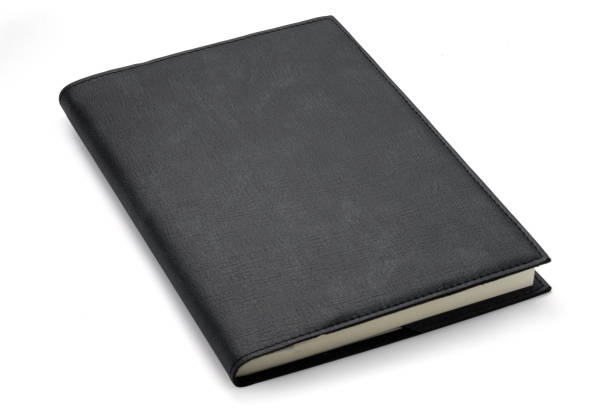 istock Closeup of top view leather black notebook on white background.Isolated with clipping path photo. 1217101693