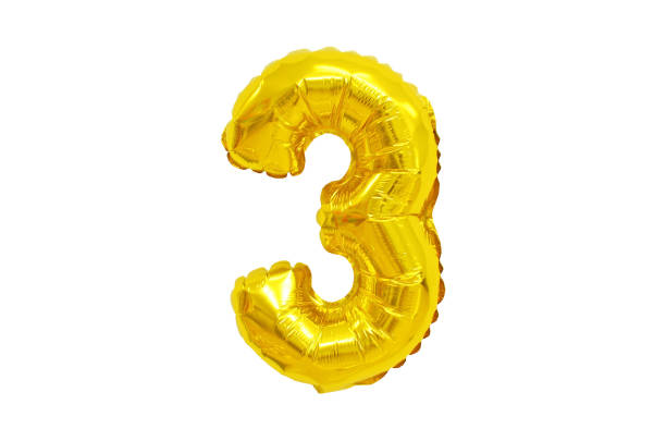 istock Golden Foil Balloon numbers in White Background 1217103100
