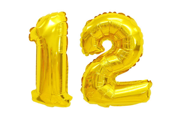 istock Golden Foil Balloon numbers in White Background 1217103173