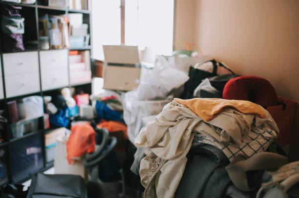 istock untidy domestic room full with unfolded and dirty clothes on iron board 1217103276
