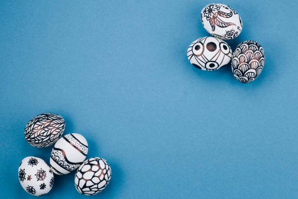 istock Easter eggs are painted in black and white lie in the corners diagonally 1217106542