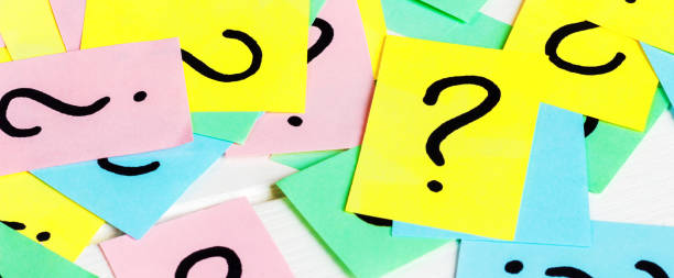 istock Just a lot of question marks on colored papers 1217108122