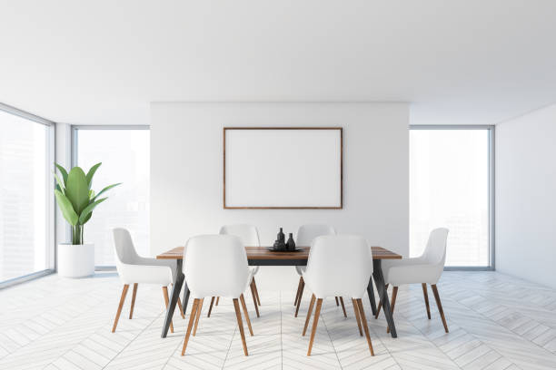 istock Minimalistic white dining room with poster 1217108195