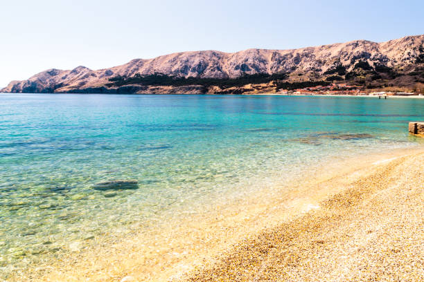 istock The bay of Baska in a sunny day 1217108471
