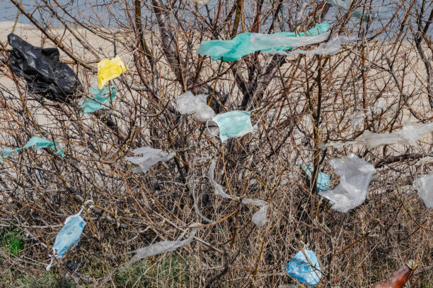 istock Coronavirus (COVID-19) is contributing to pollution, as discarded face masks clutter urban parks & streets of the city along with plastic and other trash. Ecological pollution problem 1217108635