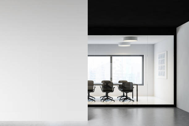 istock White and black meeting room with mock up wall 1217108885