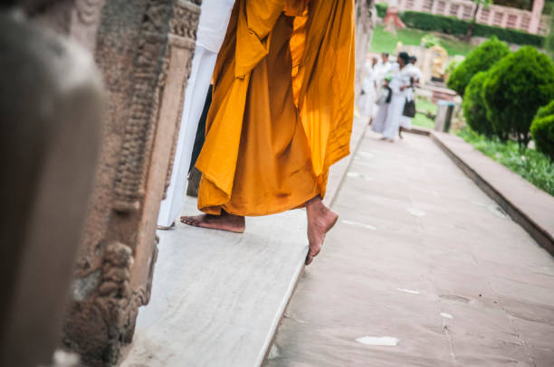 istock Buddhist monk feet walking with flip flops 1217110393
