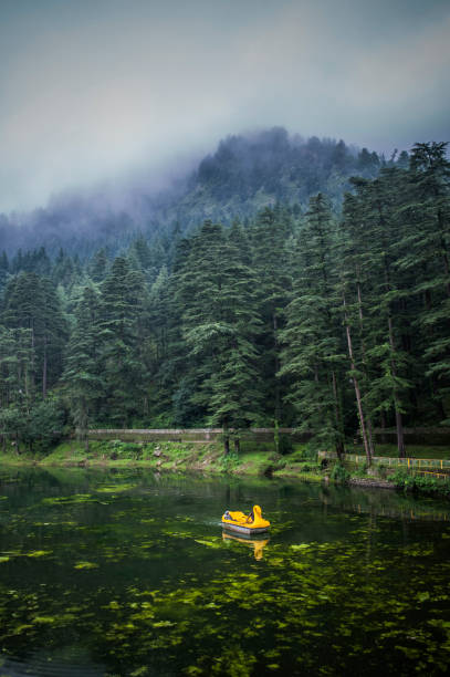 istock boat on a lake between the mountains 1217110427