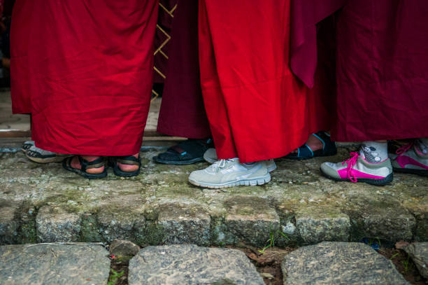 istock feet of buddhist monks lining up waiting 1217110453