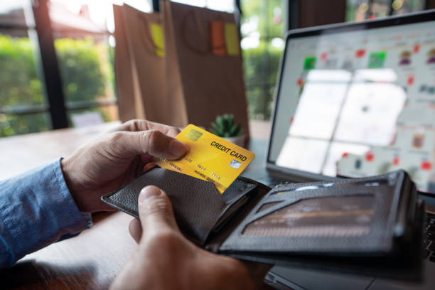 istock Online shopping credit card data security concept, Hands holding credit card and using smart phone or laptop to shopping or making online payment 1217111296