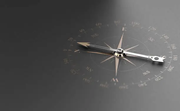 Photo of Business Guidance Or Orientation Concept. Compass over Black Background