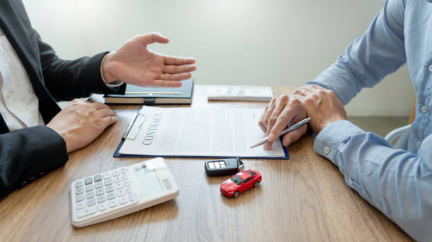 istock agent broker man holding document showing an transportation contract form to client ownership  customer and salesman with car key 1217111357