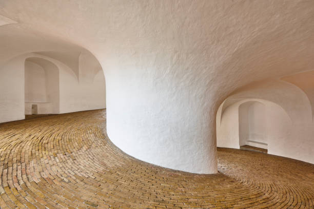 round tower passage in copenhaguen city center. denmark landmark building - denmark copenhagen brick street imagens e fotografias de stock