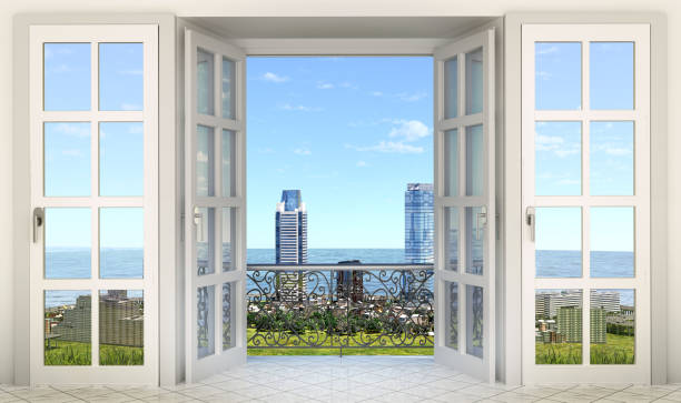 istock French window with balcony and city view- 3d rendering 1217112983