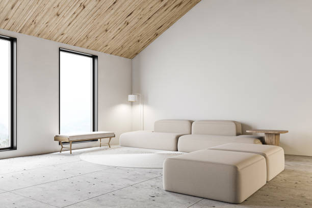 istock White attic living room corner with sofa 1217113229