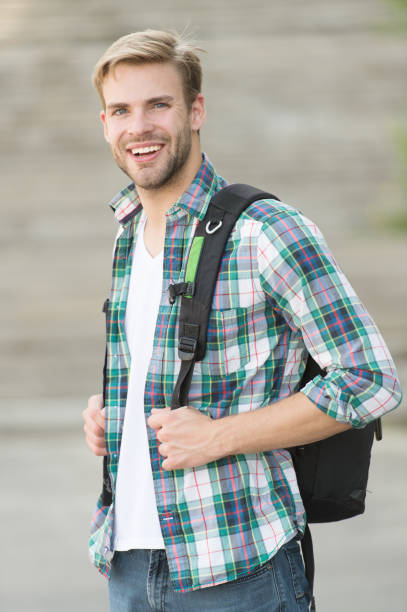 Education boost successful future. Man regular student appearance. College education. College life. Modern student. College student with backpack urban background. Handsome guy study in university.