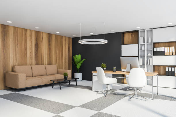istock Wooden and gray CEO office corner with sofa 1217114308