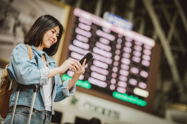 istock woman travel backpacker using smartphone 1217114615