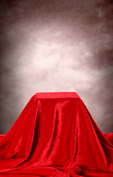 istock empty red velvet pedestal with copy space for product display 1217115727