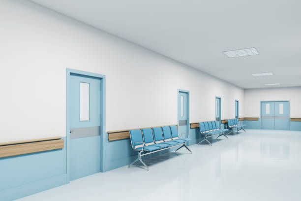 istock View of white and blue hospital corridor 1217115882