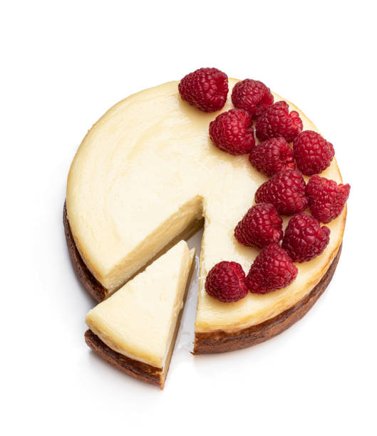 istock Homemade cheesecake with raspberry isolated on white. Top view 1217116014
