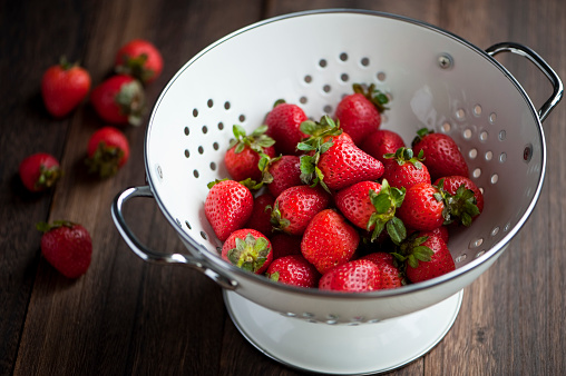 close up of strawberries in the colander