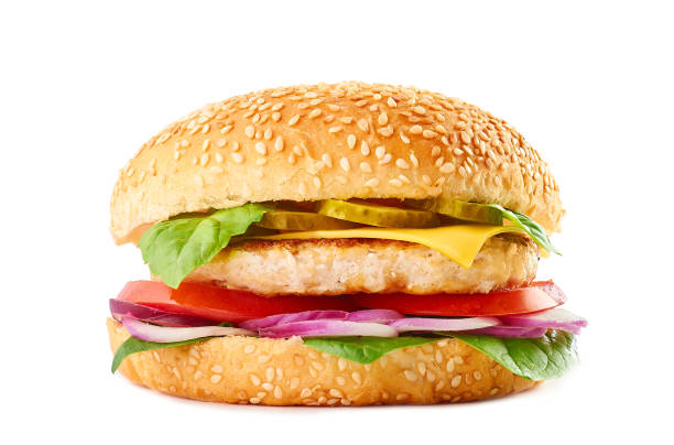 istock Classic burger with beef or chicken cutlet, tomatoes. fermented cucumber, red onion, cheese, basil and spinach in sesame bun. Isolated on white background. American burger. 1217117124