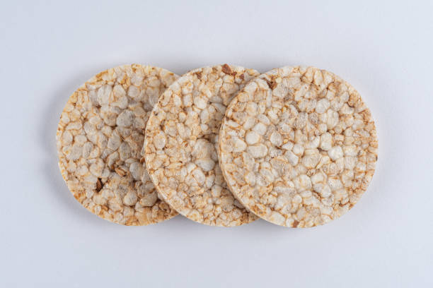 istock Pile of three rice cakes on white backdrop. Food background. 1217118261