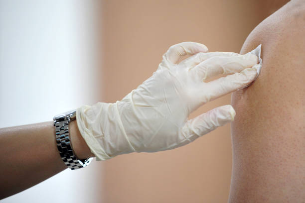 Injection with hospital sanitary gloves on. stock photo