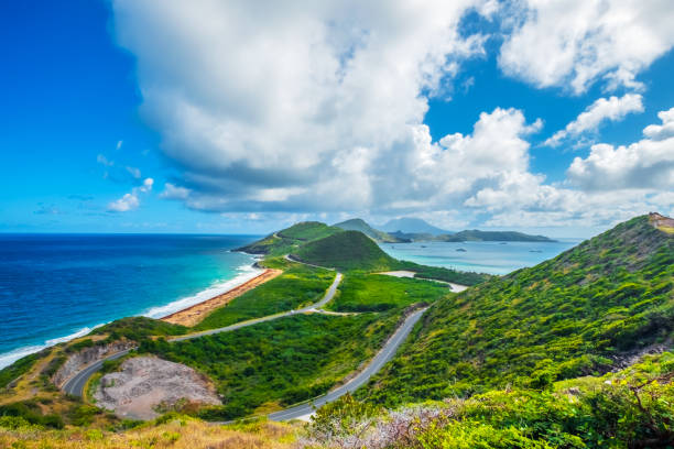 Saint Kitts with Atlantic Ocean and Caribbean Sea and the Island of Nevis A panoramic view, Saint Kitts with Nevis Island in the background. west indies stock pictures, royalty-free photos & images