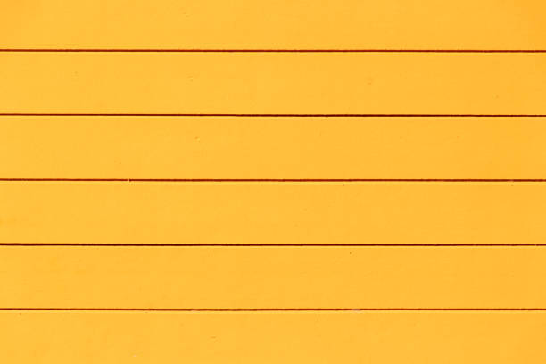 Yellow color wood plate textured background for decoration