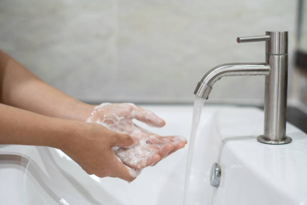 istock Washing hands rubbing with soap proper technique under bathroom sink for antibacterial Prevent coronavirus (covid-19) epidemic. Prevention of flu disease 1217124630