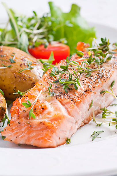 istock Roasted Salmon steak with Jacket Potato 121712671