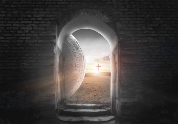 istock Easter Sunday concept: Tomb empty with cross on sunset background 1217127104
