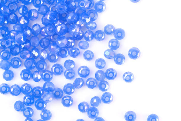 istock close up multi colored beads heap isolated on white 1217127279