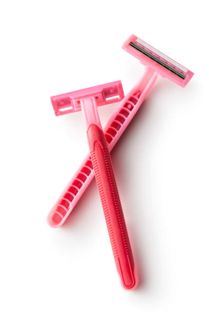 istock Toiletries: Pink Razors Isolated on White Background 1217127339